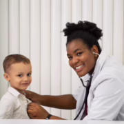 side-view-smiley-doctor-checking-patient_23-2149726974